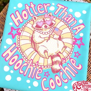 May include: A turquoise canvas print featuring a cartoon raccoon wearing heart-shaped sunglasses and holding an American flag. The text reads "Hotter Than A Hoochie Coochie" in pink, with stars and a decorative border.