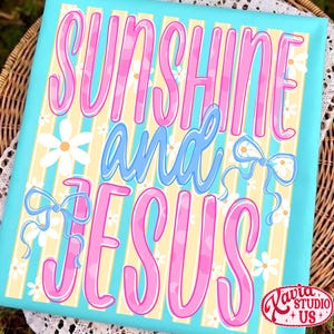 May include: A rectangular canvas art piece with the words "SUNSHINE and JESUS" in pink and blue script. The background features yellow and white stripes, with daisy and bow accents. The canvas is framed in a light blue color.