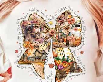 May include: White sweatshirt featuring a large bow design with fall-themed imagery. The bow includes images of Jesus, a house, flowers, and a wagon of vegetables. The text "Jesus he never leaves Fall for Jesus" is written around the bow.