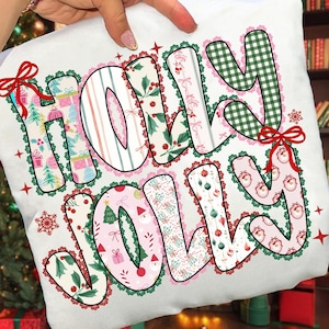May include: White Christmas-themed pillow with the words "HOLLY JOLLY" in a patchwork design. The letters are filled with festive patterns, including Christmas trees, gifts, and holly. The letters are outlined in green and pink, with red bows and snowflakes.