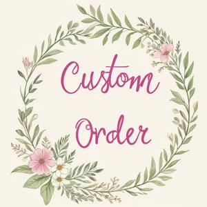 May include: A floral wreath with pink and white flowers and green leaves surrounds the text "Custom Order" in pink.