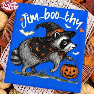 May include: A bright blue rectangular canvas print featuring a gray raccoon wearing a black witch hat and a black cape with orange stars and a crescent moon. The raccoon holds an orange jack-o'-lantern bucket. The text Jim-boo-thy is printed above.