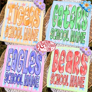 May include: Four colorful school-themed signs with the words "Tigers", "Gators", "Eagles", and "Bears" in large, bubble letters. Each sign includes the text "School Name" and is decorated with stars and flowers. The signs are on a woven background.