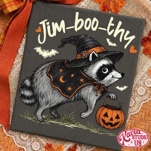 May include: A rectangular black canvas print featuring a gray raccoon wearing a black witch hat and a black cape with orange stars and a crescent moon. The raccoon holds an orange jack-o'-lantern bucket. The text Jim-boo-thy is printed above.