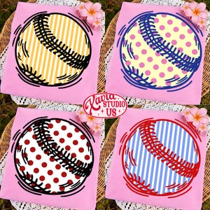 May include: Four pink t-shirts with baseball designs. Each shirt features a baseball graphic with different patterns: yellow stripes, pink polka dots, red polka dots, and blue stripes. The shirts are arranged on a woven surface with floral accents.