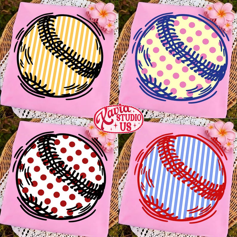 May include: Four pink t-shirts with baseball designs. Each shirt features a baseball graphic with different patterns: yellow stripes, pink polka dots, red polka dots, and blue stripes. The shirts are arranged on a woven surface with floral accents.