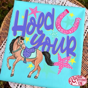 May include: A turquoise canvas with a cartoon horse wearing a saddle. The text "Hold Your" is in purple script, with a pink horseshoe and stars. The horse is brown with a black mane and tail. Yellow and pink stars are scattered around the horse and text.
