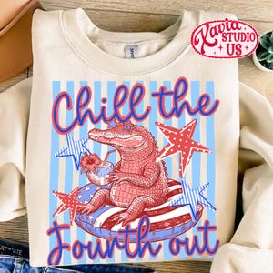May include: Cream-colored sweatshirt with a graphic of an alligator wearing sunglasses and floating on an inner tube. The design includes red, white, and blue stars and stripes, with the text "Chill the Fourth out."