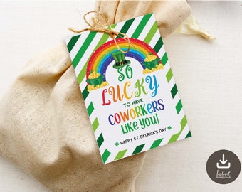 May include: A green and white striped card with a rainbow and a pot of gold. The card says "So lucky to have coworkers like you! Happy St. Patrick's Day!"