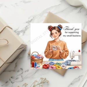 Puede incluir: Ilustración de una mujer sosteniendo una scrunchie, con una máquina de coser y una cesta de scrunchies. La imagen incluye el texto "Thank you for supporting my small business."