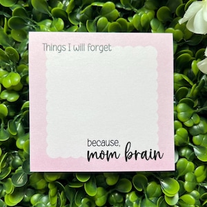 May include: Pink notecard with the text "Things I will forget because, mom brain".