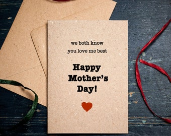 May include: A brown card with the text "we both know you love me best Happy Mother's Day!" and a red heart.