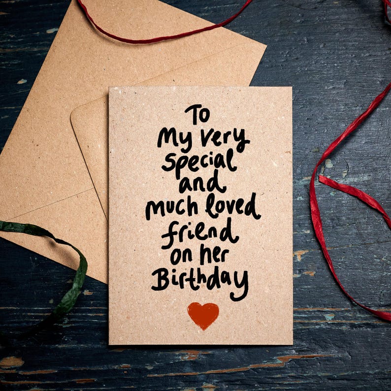 May include: A brown card with the text "To my very special and much loved friend on her Birthday" written in black marker. A red heart is drawn at the bottom of the card.