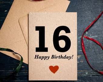 May include: A birthday card with the number 16 in large black font, the words "Happy Birthday!" and a red heart. The card is on a brown envelope with a red ribbon and a green ribbon.