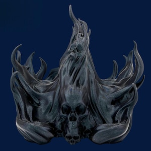May include: A dark gray sculpture featuring multiple skulls and flowing, flame-like forms. The gothic-style art piece has a textured surface and is set against a dark blue background. The sculpture's design evokes a sense of mystery and the macabre.