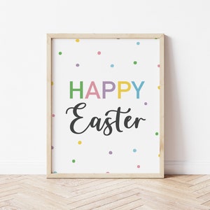 May include: A framed print with a white background and colourful confetti. The text "HAPPY Easter" is written in black with the word "HAPPY" in rainbow colours.