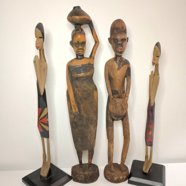 4 Vintage Hand Carved  African Figurines. 3" x 13.5" 14.5" x 3.5"