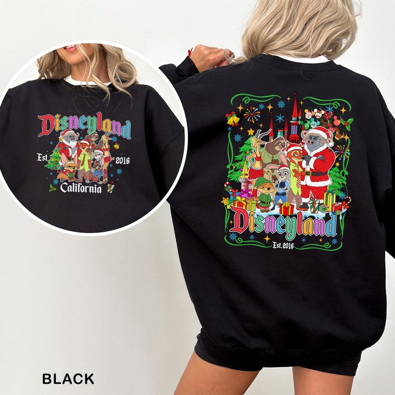 May include: Black sweatshirt with a colorful Disneyland graphic. The design features various Disney characters in festive attire, with the text "Disneyland Est. 2016 California". The sweatshirt has a crew neck and long sleeves.