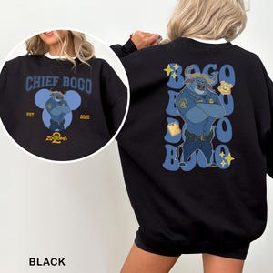 May include: Black sweatshirt featuring Chief Bogo from Zootopia. The front design includes the text "CHIEF BOGO" above an illustration of Chief Bogo in a police uniform. The back design repeats "BOGO" with an illustration of Chief Bogo.