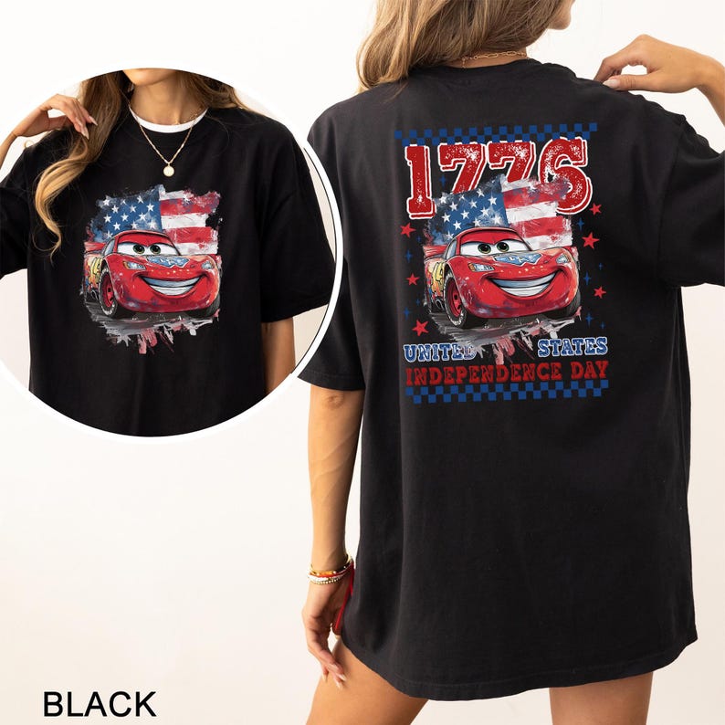 May include: A black t-shirt featuring a graphic of a red race car in front of an American flag. The back design includes the text 1776 and UNITED STATES INDEPENDENCE DAY, accented with red stars and a blue and white checkered border pattern.