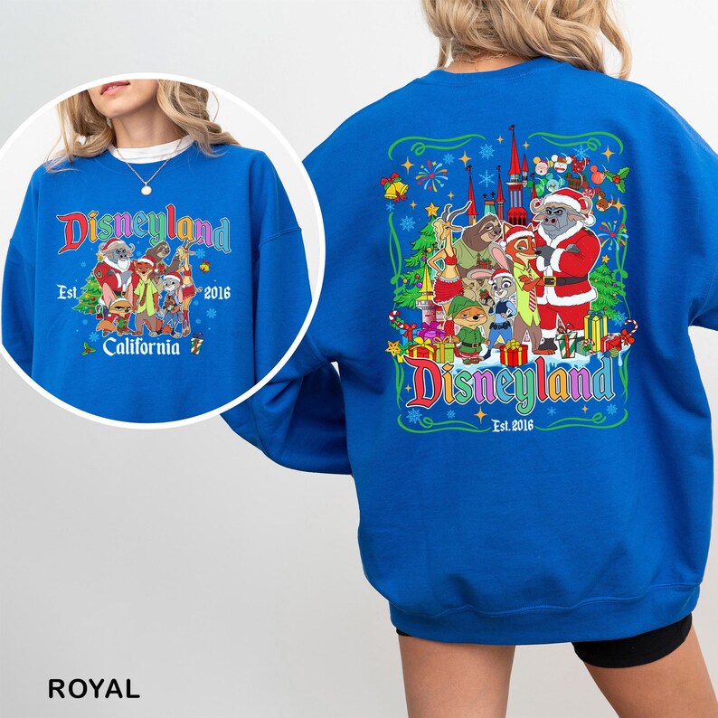 May include: Royal blue Disneyland sweatshirt with a colorful graphic featuring Disney characters in a holiday theme. The front of the sweatshirt has the Disneyland logo, the text "Est. 2016", and "California". The back has a larger graphic.