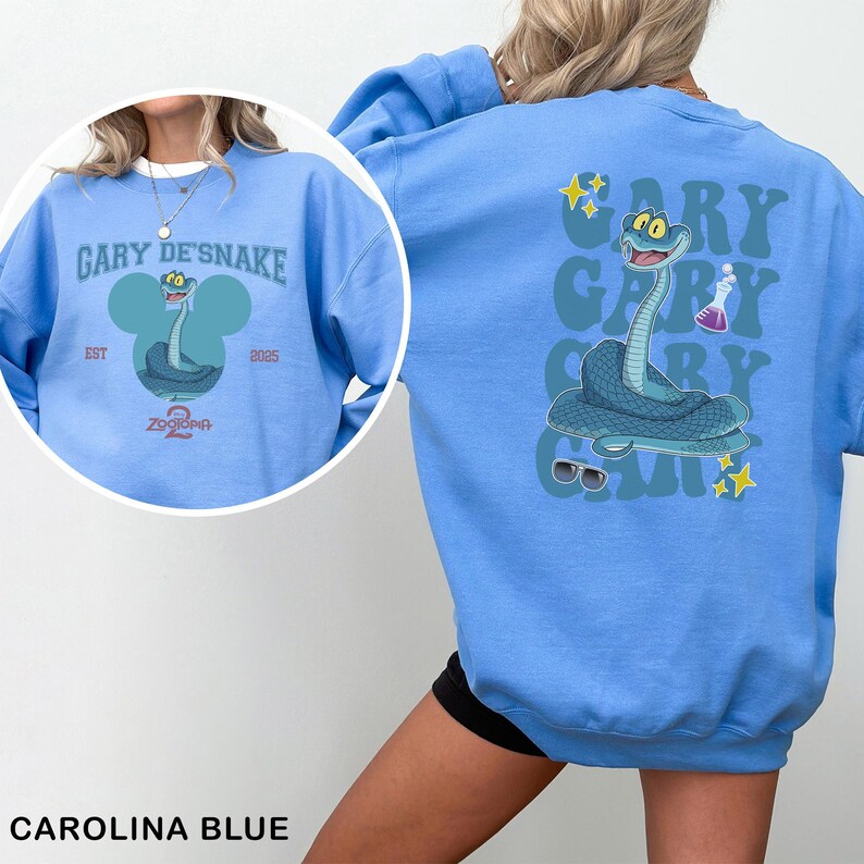 May include: Carolina blue sweatshirt featuring a cartoon snake character with the text "GARY DE'SNAKE" and "ZODORIA 2". The back of the sweatshirt has a larger graphic of the snake with the text "GARY" repeated vertically.