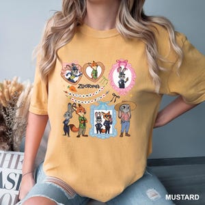 Op de afbeelding: Mosterdkleurig T-shirt met stripfiguren uit Zootopia. Het ontwerp bevat afbeeldingen van een vos, konijnen en andere personages in verschillende kaders en poses, met het woord "Zootopia" en de zin "welcome to Zootopia".