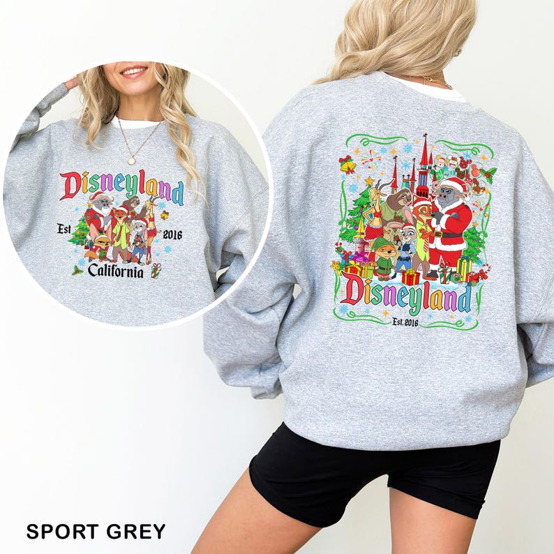 May include: Sport grey sweatshirt featuring a Disneyland graphic with cartoon characters and text. The front of the sweatshirt displays the Disneyland logo, the text "Est. 2016", and "California". The back has a larger graphic with the Disneyland logo.
