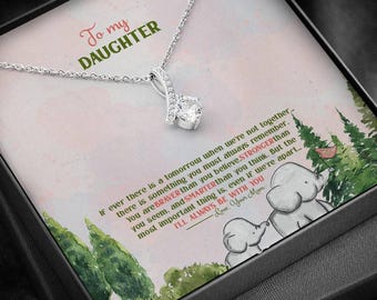 Collar con colgante de lazo para hija, circonita cúbica y acabado en oro blanco.