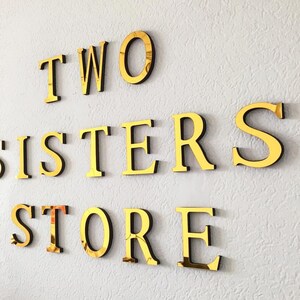 Wall Mounted Mirrored Gold Foamex Sign