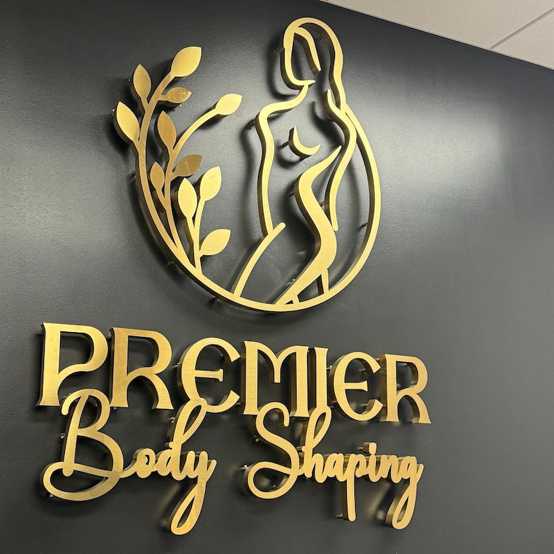 indoor sign.
made of stainless metal.
color brushed gold.
1 inch from the wall.
letter thickness is 1 inch.