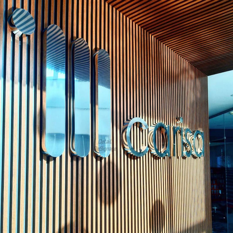 Shiny silver logo sign for Reception,
custom welcome signage