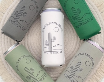 May include: Several insulated can coolers in shades of grey, green, and white. Each cooler displays a desert cactus design and the text "Clare's Bachelorette Scottsdale, AZ".