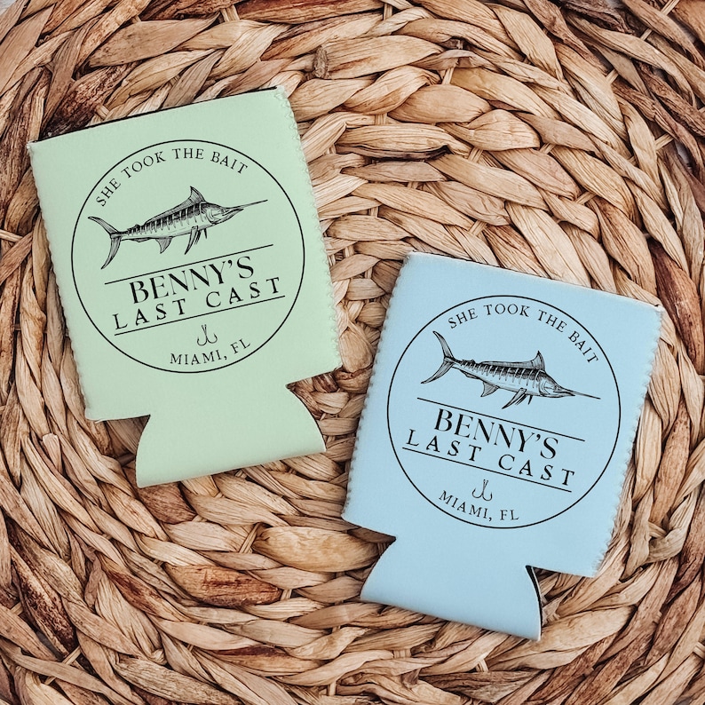 May include: Two green and blue can coolers with a marlin fish graphic and the text "She took the bait Benny's Last Cast Miami, FL".