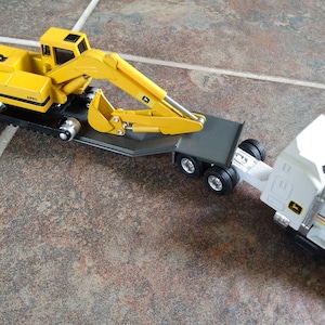 Ertl John Deere Die Cast Toys - Farm Tractors - Excavator - Backhoe and Int&#39;l Paystar 5000 w/Gravel Dump Trailer