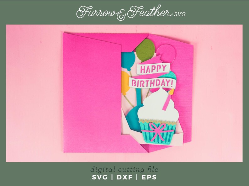 May include: A pink card with a pop-up cupcake and balloons. The cupcake is decorated with a pink bow and the balloons are blue, yellow, and green. The card says "Happy Birthday!" in white letters.