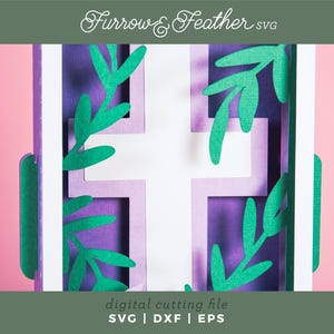 May include: A white cross with purple and green paper leaves surrounding it. The image is a digital cutting file for a craft project. "Furrow & Feather SVG" is written at the top of the image.
