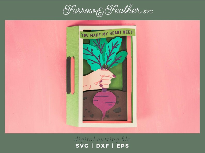 May include: A green and brown card with a pop-up beet. The beet is being held by a hand. The card says "You make my heart beet!"
