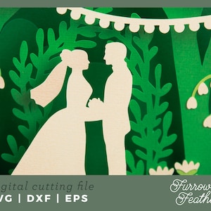 May include: A digital cutting file featuring a silhouette of a bride and groom standing in a forest setting with greenery and flowers. The file is available in SVG, DXF, and EPS formats.  The text "Furrow & Feather" is in the lower right corner of the image.