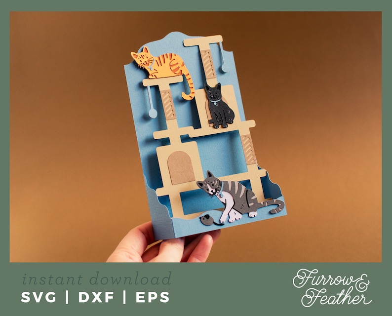 May include: A blue and brown cat tree with three levels, a cat toy, and three cats. The top level has a brown cat, the middle level has a black cat, and the bottom level has a gray and white cat. The cat tree is made of paper and is a digital download.