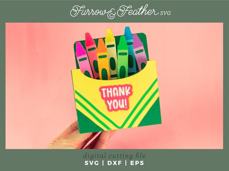 May include: A green and yellow card with a box of crayons and the words "Thank You!" in a white box. The card is perfect for a teacher or student.