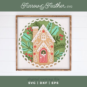 May include: A framed, square wooden sign featuring a gingerbread house design. The house is tan with white frosting details, a pink door, and red berry accents. The background is green with white scalloped edges. Text at the top reads "Furrow & Feather SVG".