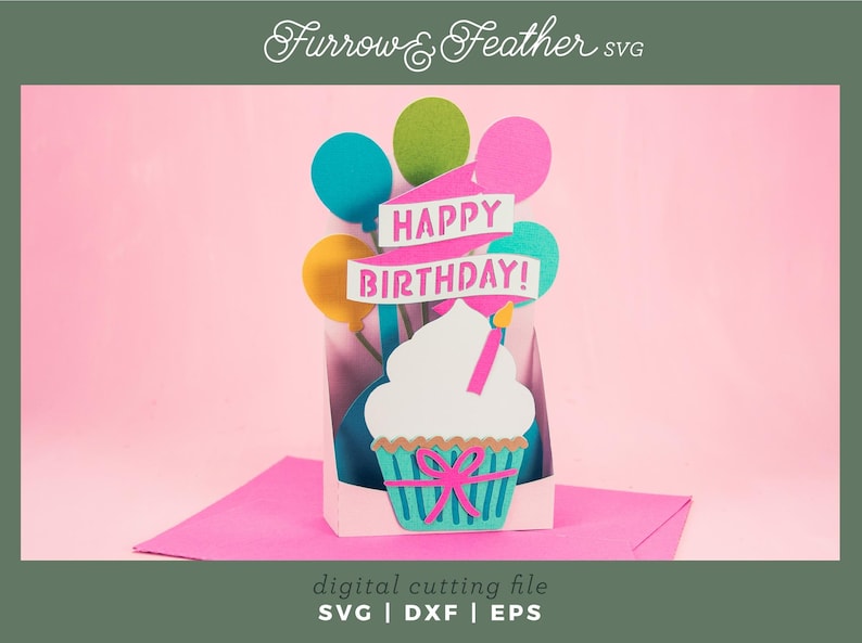 May include: A digital cutting file for a birthday card featuring a cupcake with a candle and balloons with the text "Happy Birthday!"
