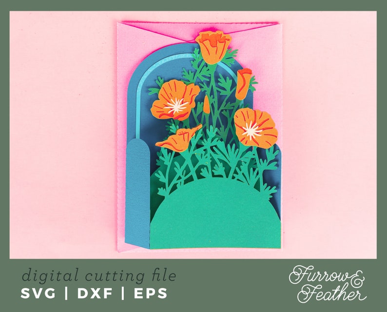 May include: A digital cutting file featuring a pop-up card design with a bouquet of orange California poppies in a blue and green archway. The file is available in SVG, DXF, and EPS formats. Furrow & Feather.