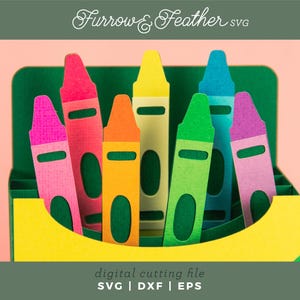 May include: A digital cutting file for a set of seven crayons in a box. The crayons are red, orange, yellow, green, blue, purple, and pink. The file is available in SVG, DXF, and EPS formats. Furrow & Feather SVG.