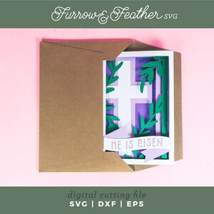 May include: A digital cutting file for a card with a purple cross and green leaves, with the text "HE IS RISEN" on a banner. The card is in a brown envelope.