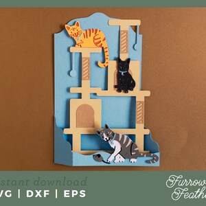 May include: A blue and brown cat tree with three levels. A yellow cat sits on the top level, a black cat sits on the middle level, and a gray cat sits on the bottom level. A small gray mouse toy is on the bottom level.