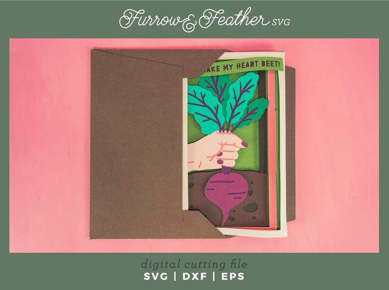 May include: A digital cutting file for a layered paper craft card featuring a beet with green leaves and the text "MAKE MY HEART BEET!" The card is designed to be cut with a cutting machine.