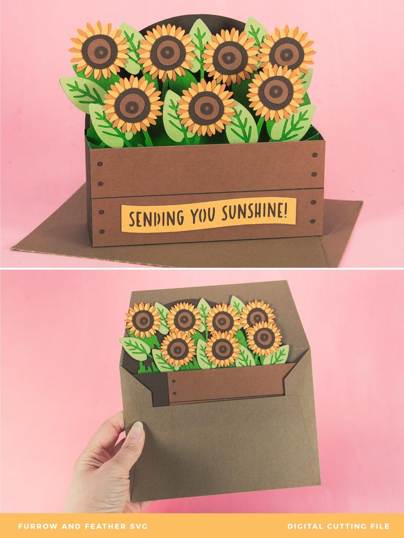 May include: A brown paper card featuring a 3D sunflower arrangement. The sunflowers have yellow petals and brown centres, with green leaves. The card reads "SENDING YOU SUNSHINE!"