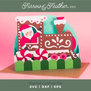 May include: A festive papercraft train featuring Santa Claus waving from the engine. The brown train has white accents and is decorated with candy canes and a green picket fence. The image includes the text "Furrow & Feather SVG" and "digital cutting file".